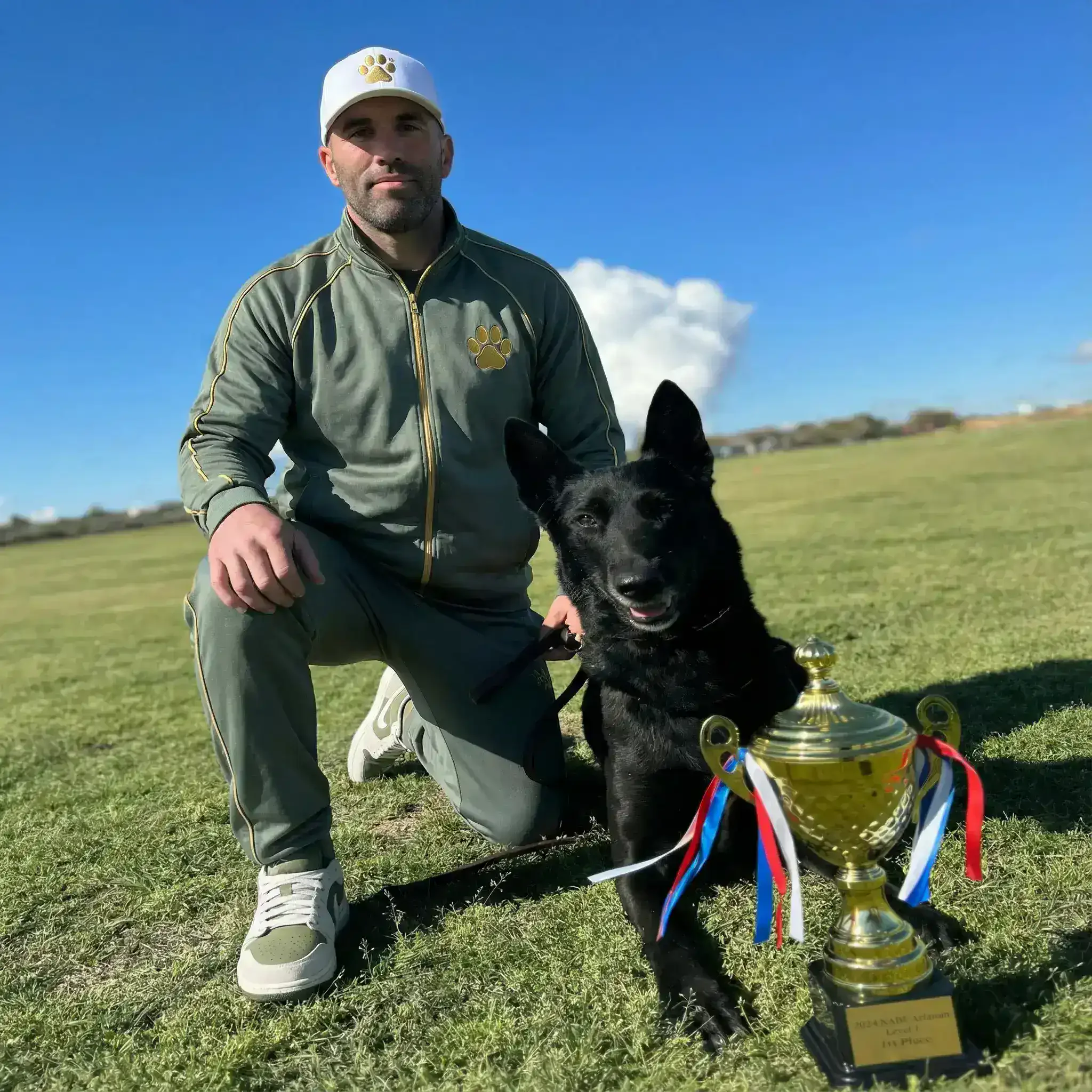 Mike with championship trophy and working dog